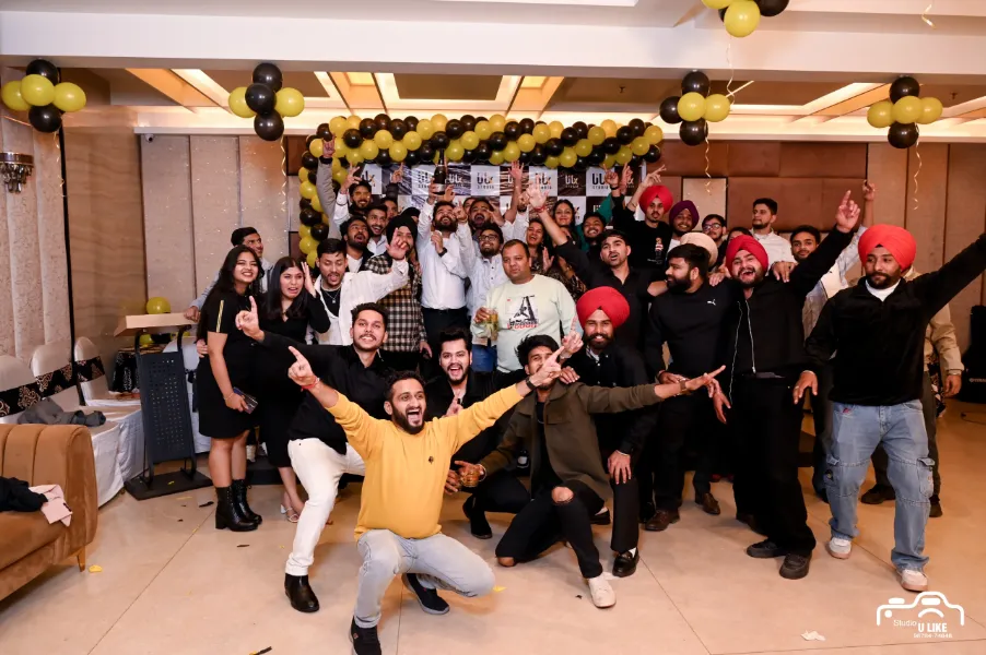 UIUX Studio team celebrating at an office party