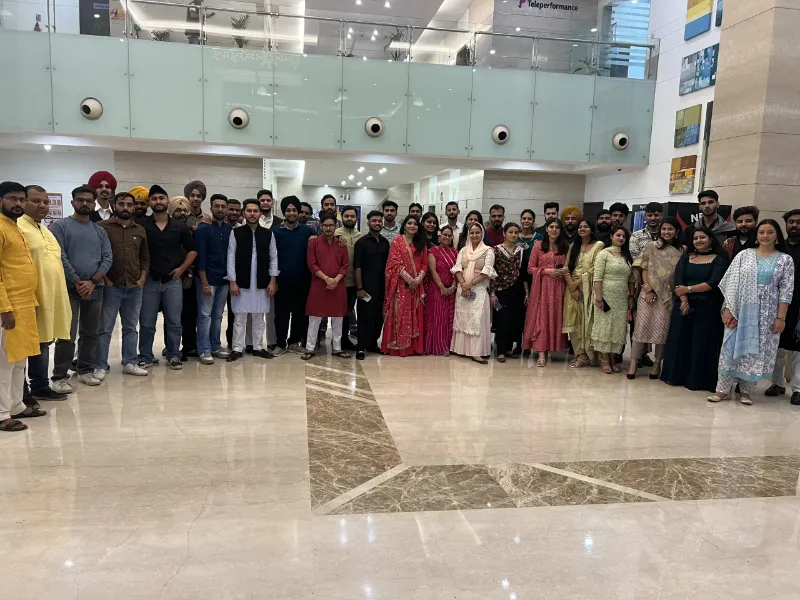 UIUX Studio team group photo in the office lobby