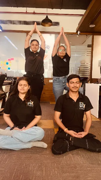 UIUX Studio team members in the office