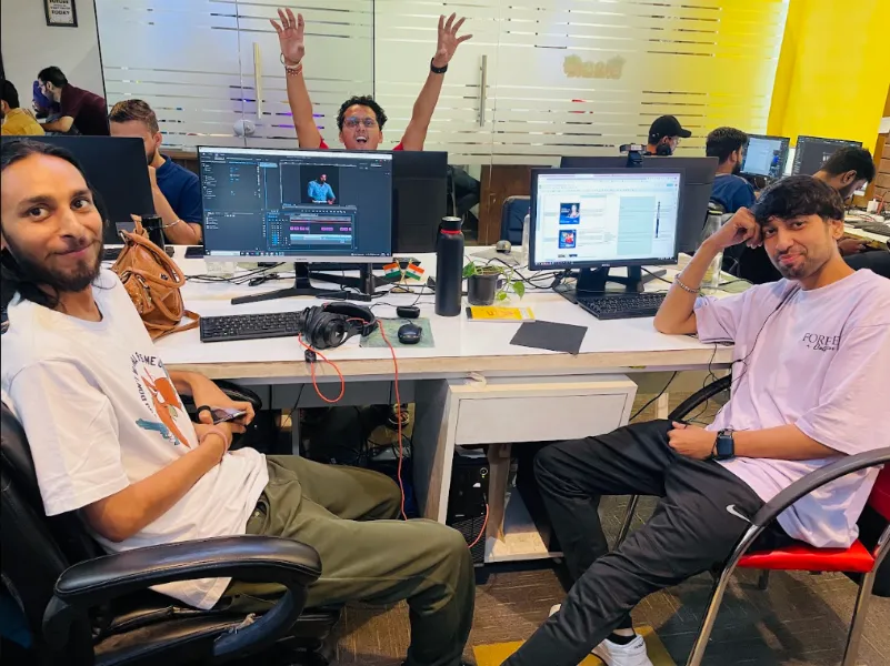 UIUX Studio developers at their desks in the office