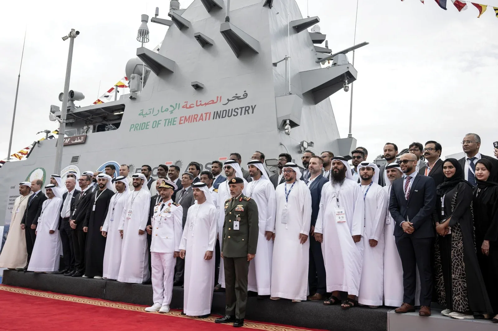 Delegation in front of the Pride of the Emirati Industry naval vessel at its unveiling